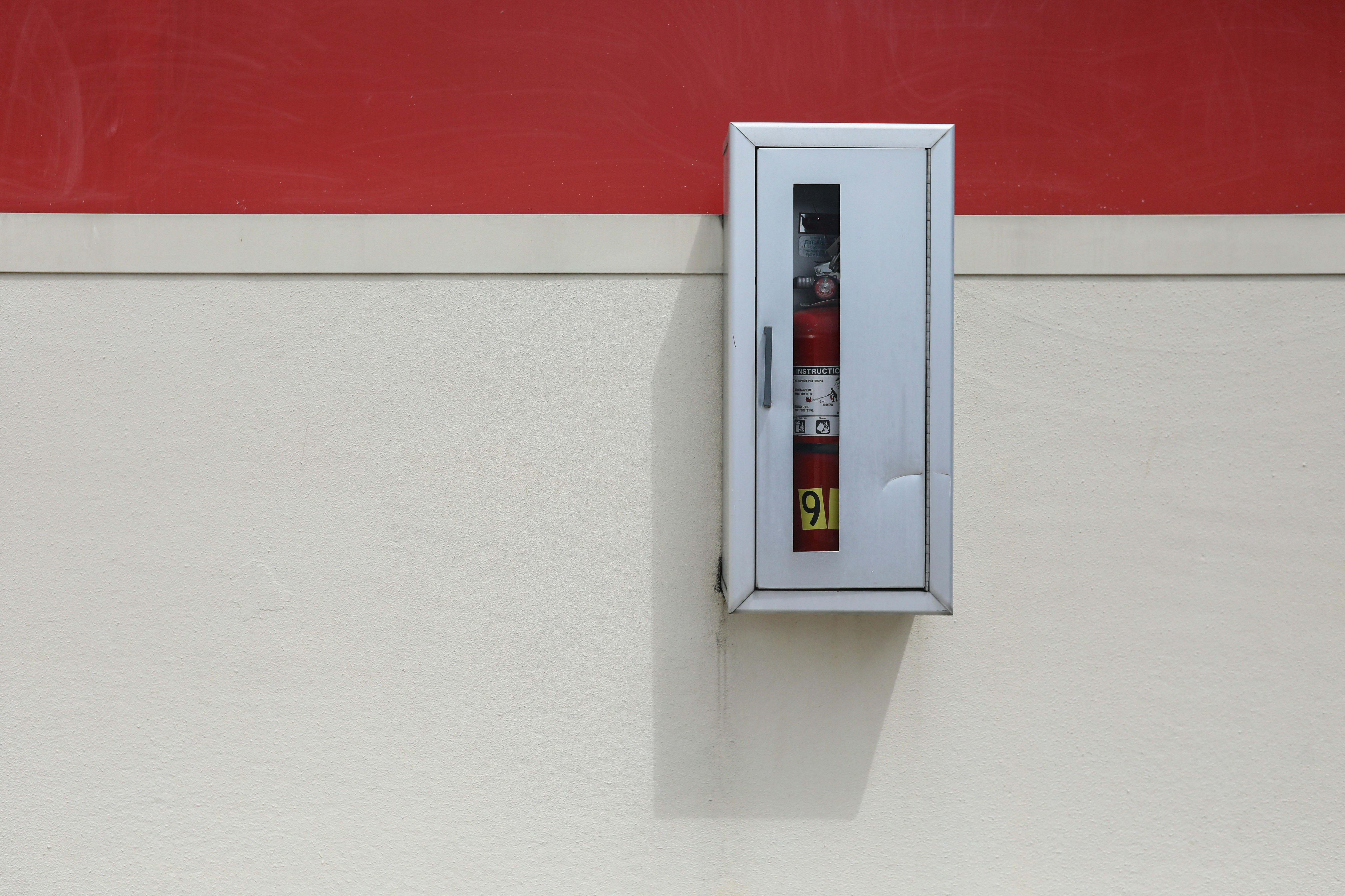 white and red fire extinguisher